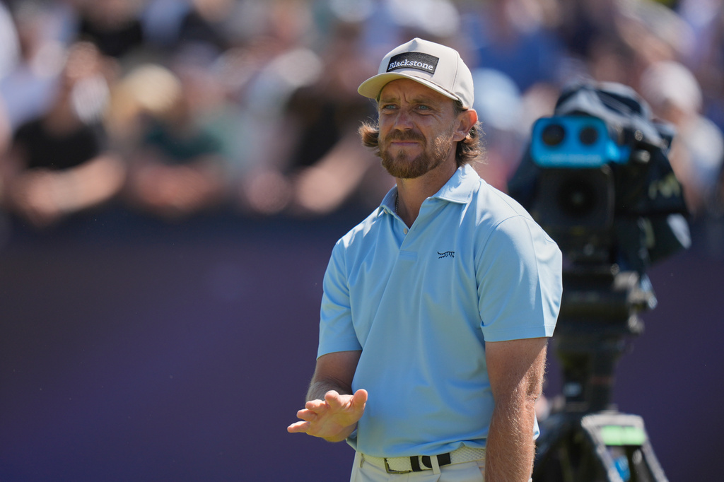 Tommy Fleetwood of England reacts to his tee shot on the 4th hole during the final day of the British Open Golf championships at Royal Birkdale golf club, in Southport, England, Sunday, July 19, 2026. (AP Photo/David Goldman)