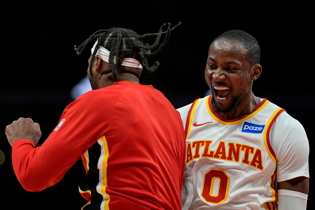Atlanta Hawks forward Jonathan Kuminga (0) celebrates his basket against the Portland Trail Blazers during the second half of an NBA basketball game, Sunday, March 1, 2026, in Atlanta. (AP Photo/Mike Stewart)