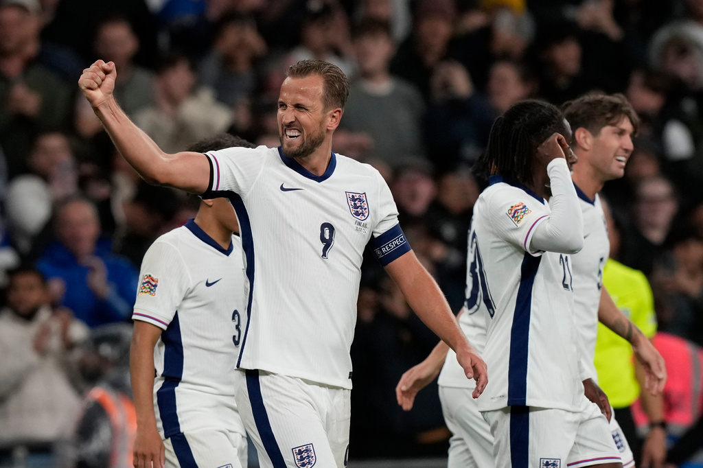 FILE - England's Harry Kane, left, celebrates after scoring his side's second goal during the Group F UEFA Nations League soccer match between England and Finland at Wembley Stadium in London, Tuesday, Sept. 10, 2024. (AP Photo/Frank Augstein, File)