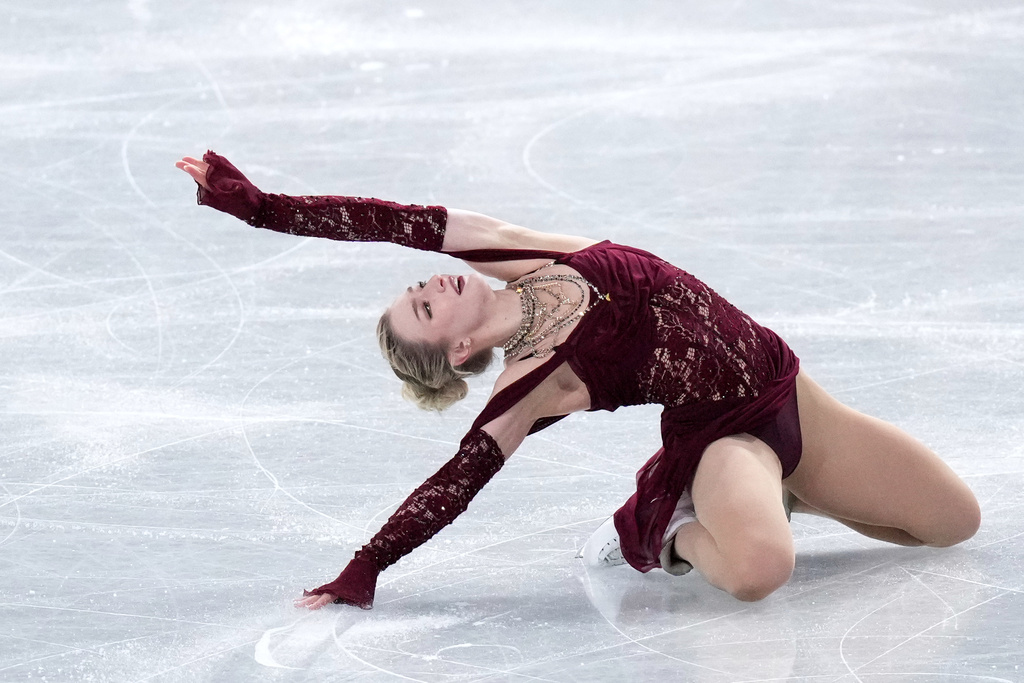 FILE - Amber Glenn, of the United States, competes in the women's short program segment at the ISU Grand Prix of Figure Skating Final in Nagoya, central Japan, Friday, Dec. 5, 2025. (AP Photo/Hiro Komae, File)