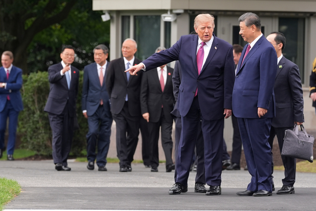 President Donald Trump, left, speaks with China's President Xi Jinping during a tour of the South Lawn of the White House, Thursday, Sept. 24, 2026, in Washington. (AP Photo/Alex Brandon)