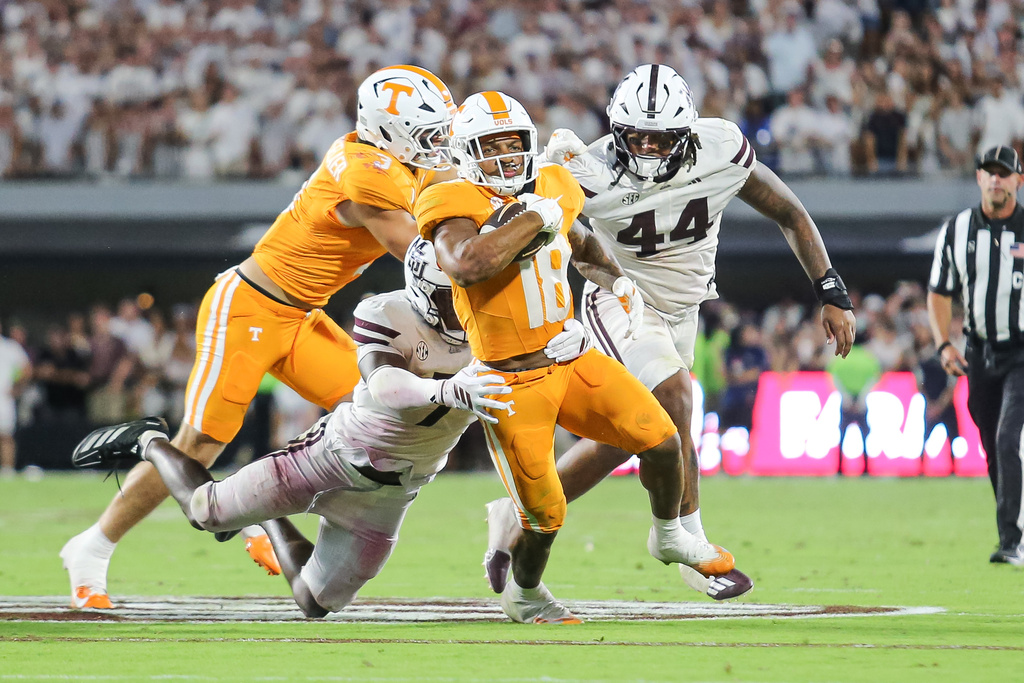 Tennessee running back DeSean Bishop (18) attempts to score a touchdown against Mississippi State during the overtime of an NCAA college football game in Starkville, Miss., Saturday, Sept. 27, 2025. (AP Photo/James Pugh)