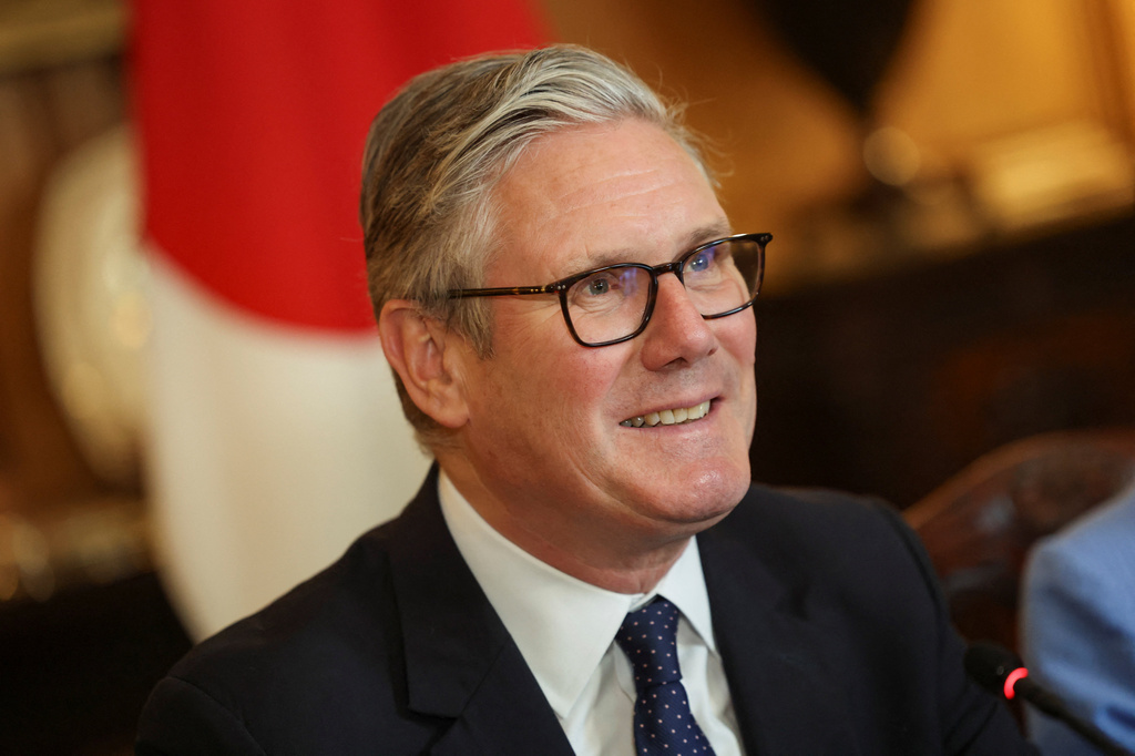 Britain's Prime Minister Keir Starmer and Japan's Prime Minister Sanae Takaichi, not pictured, attend a business roundtable meeting in Downing Street in London, Sunday, June 14, 2026. (Toby Shepheard/Pool Photo via AP)