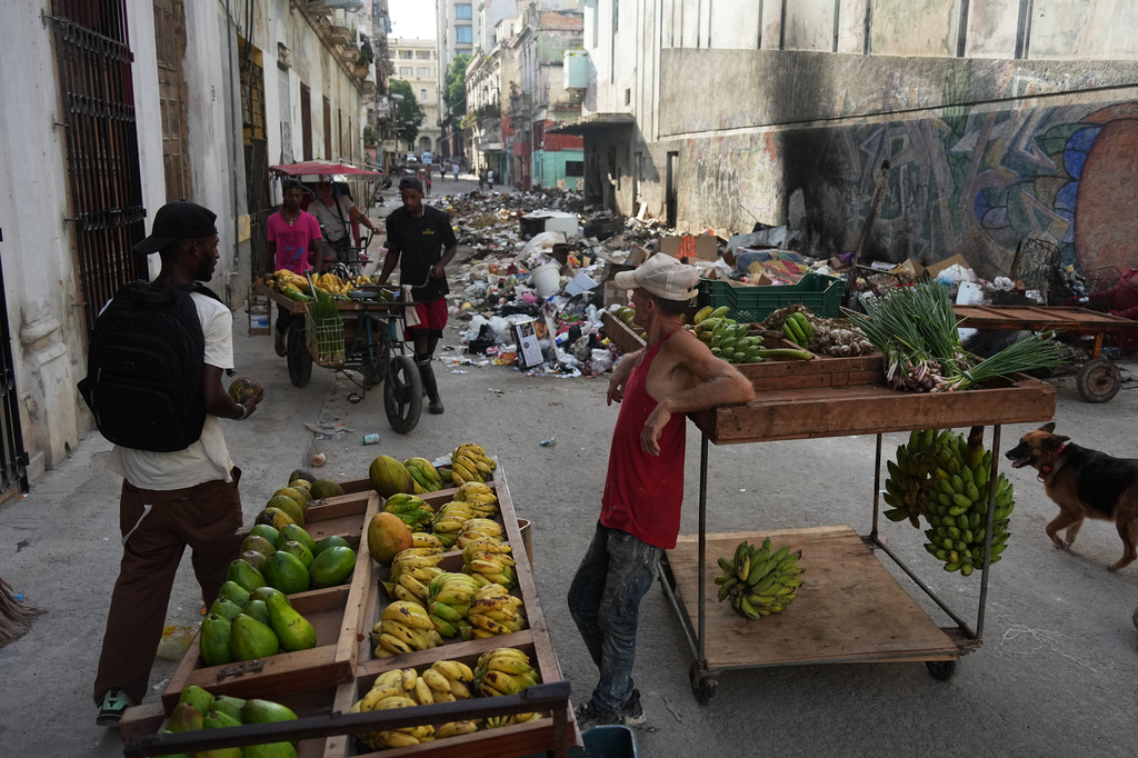 A man sells fruit during a power outage in Havana, Cuba, Monday, Aug. 3, 2026. (AP Photo/Ramon Espinosa)