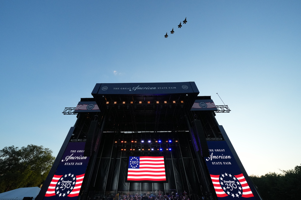 Four F-35's fly over the stage before President Donald Trump speaks at the opening of the Great American State Fair on the National Mall, Wednesday, June 24, 2026, in Washington. (AP Photo/Alex Brandon)