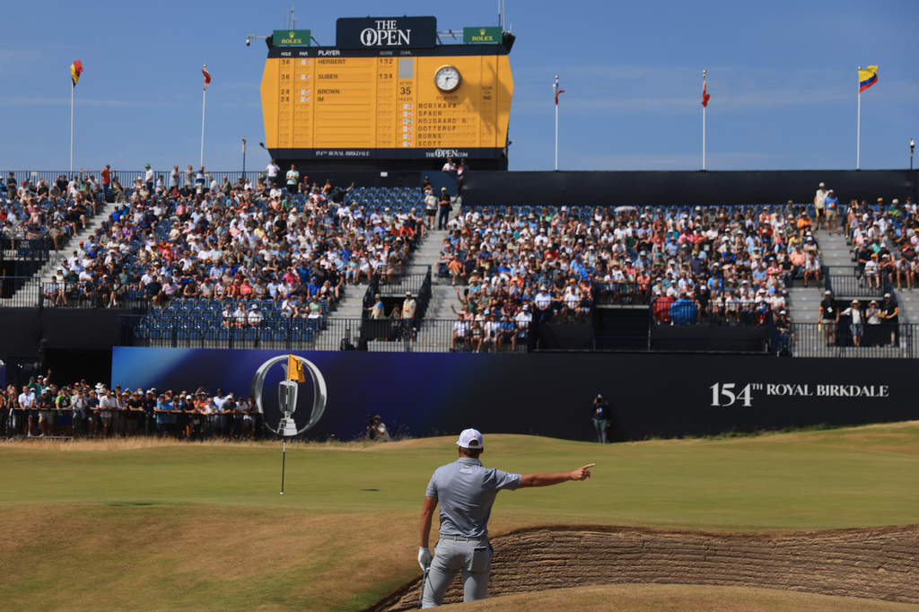 Sam Burns of the United States chips in for a birdie from a bunker on the 18th green during the second day of the British Open Golf championships at Royal Birkdale golf club, in Southport, England, Friday, July 17, 2026. (AP Photo/Peter Morrison)