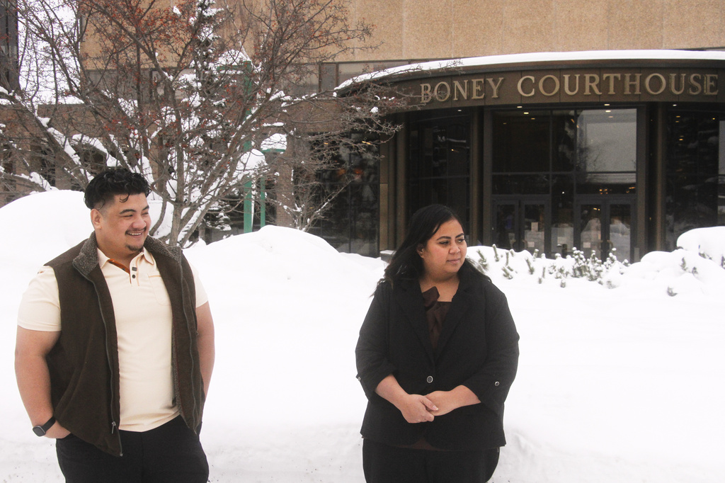 FILE - Michael Pese and his wife Tupe Smith stand outside the Boney Courthouse in Anchorage, Alaska, on Jan. 15, 2026. (AP Photo/Mark Thiessen, File)