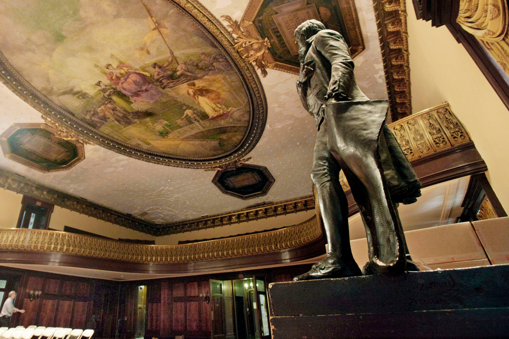 FILE - A statue of Thomas Jefferson, right, stands in New York's City Hall Council Chamber, July 14, 2010. (AP Photo/Richard Drew, File)