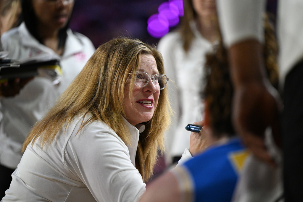 UCLA head coach Cori Close talks to her team during a timeout in the first half of an NCAA college basketball game against Michigan in Ann Arbor, Mich., Sunday, Feb. 8, 2026. (AP Photo/Lon Horwedel)