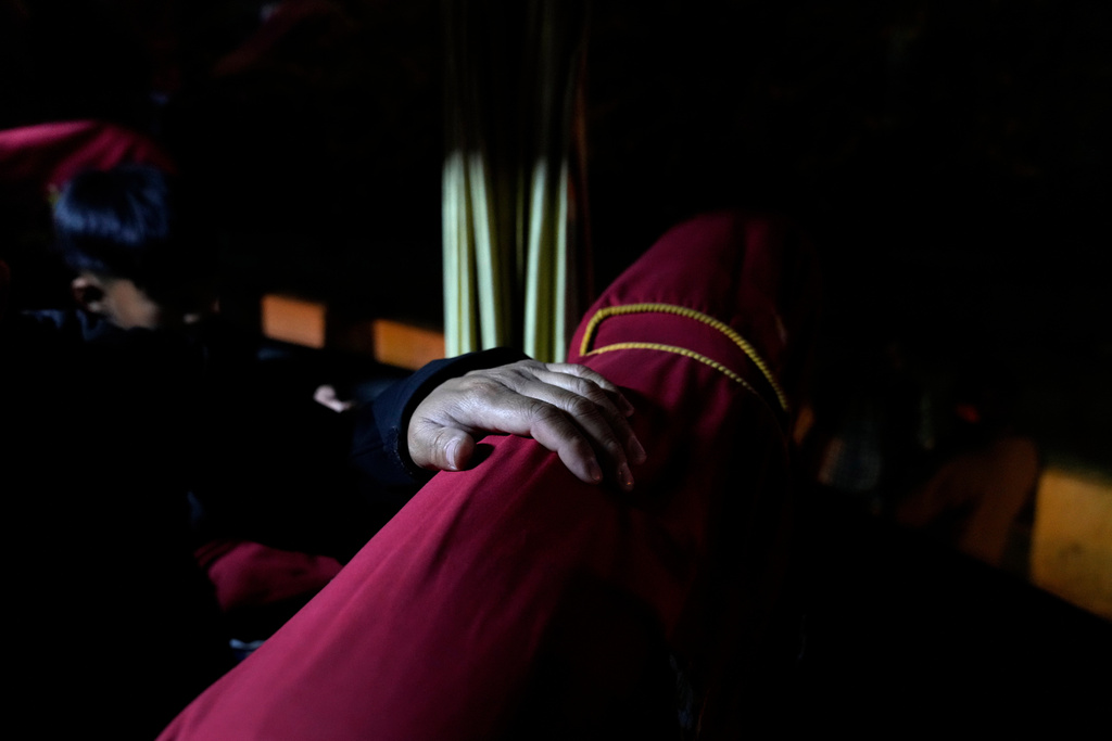 Sonam Tashi sits on a bus in New Delhi as it leaves for Dharamshala where he hopes the Tibetan government in exile there can help his son access education, March 5, 2025. (AP Photo/Manish Swarup)