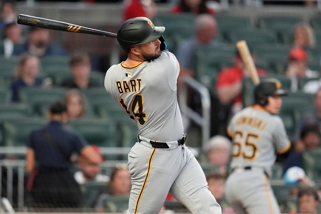 Pittsburgh Pirates catcher Joey Bart (14) hits a single against the Atlanta Braves in the second inning of a baseball game, Saturday, Sept. 27, 2025, in Atlanta. (AP Photo/Mike Stewart)
