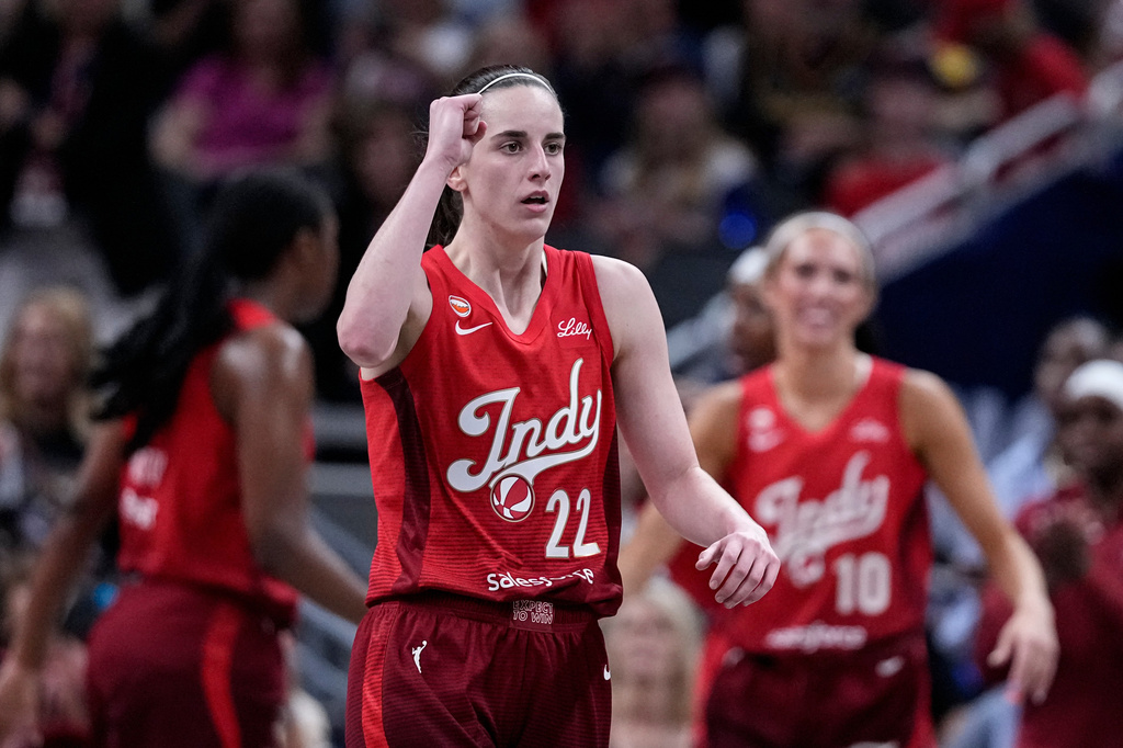 Indiana Fever guard Caitlin Clark (22) celebrates in the second half of a WNBA basketball game against the Dallas Wings in Indianapolis, Friday, Aug. 14, 2026. (AP Photo/Michael Conroy)