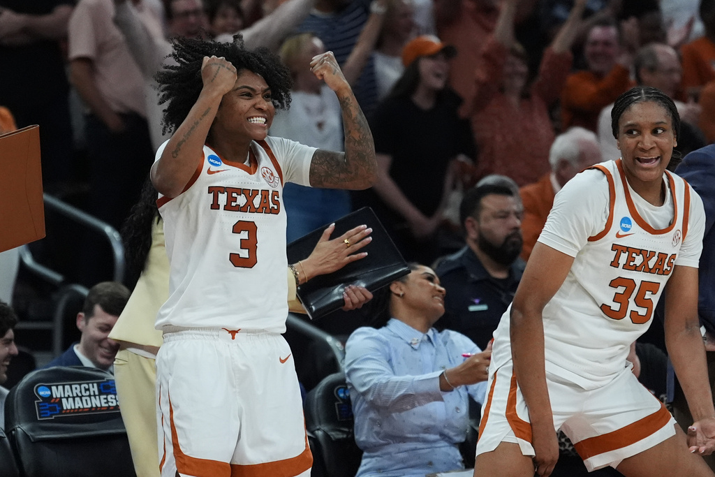 Texas guard Rori Harmon (3) and forward Madison Booker (35) celebrate during the second half in the first round of the NCAA college basketball tournament game against Missouri State, Friday, March 20, 2026. (AP Photo/Eric Gay)