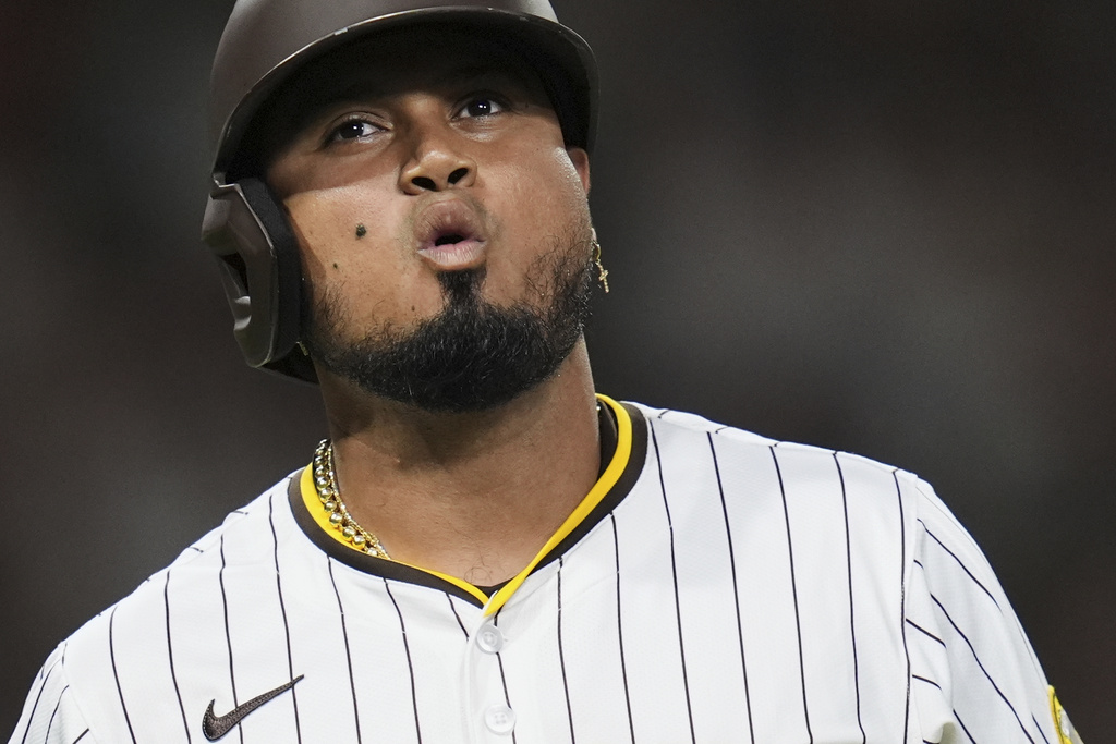San Diego Padres' Luis Arraez exhales as he watches a ball go foul while batting during the fifth inning of a baseball game against the Baltimore Orioles Tuesday, Sept. 2, 2025, in San Diego. (AP Photo/Gregory Bull)
