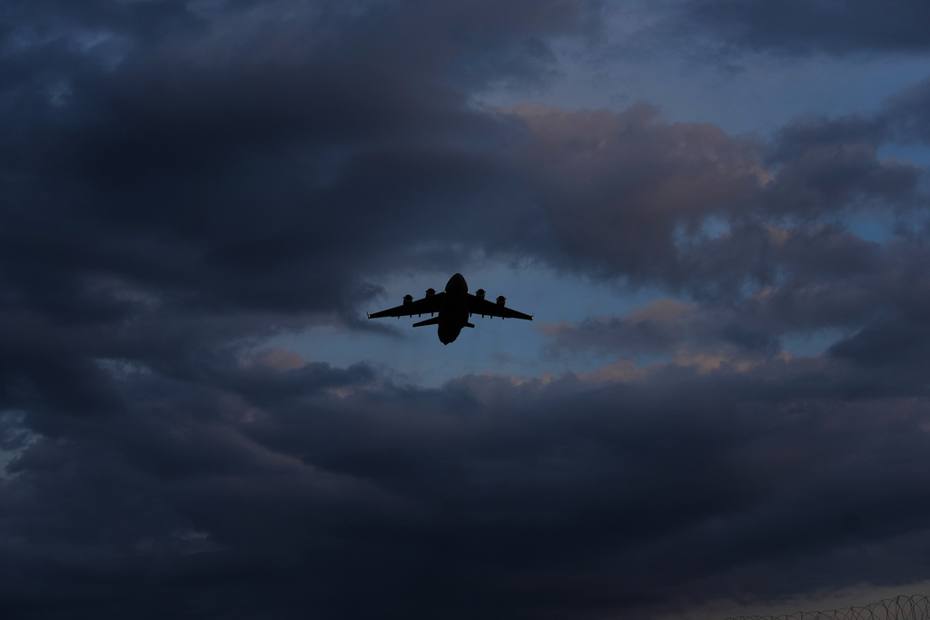 A transport aircraft takes off from the U.K.'s RAF Akrotiri air base near Limassol, Cyprus, Friday, March 6, 2026. (AP Photo/Petros Karadjias)
