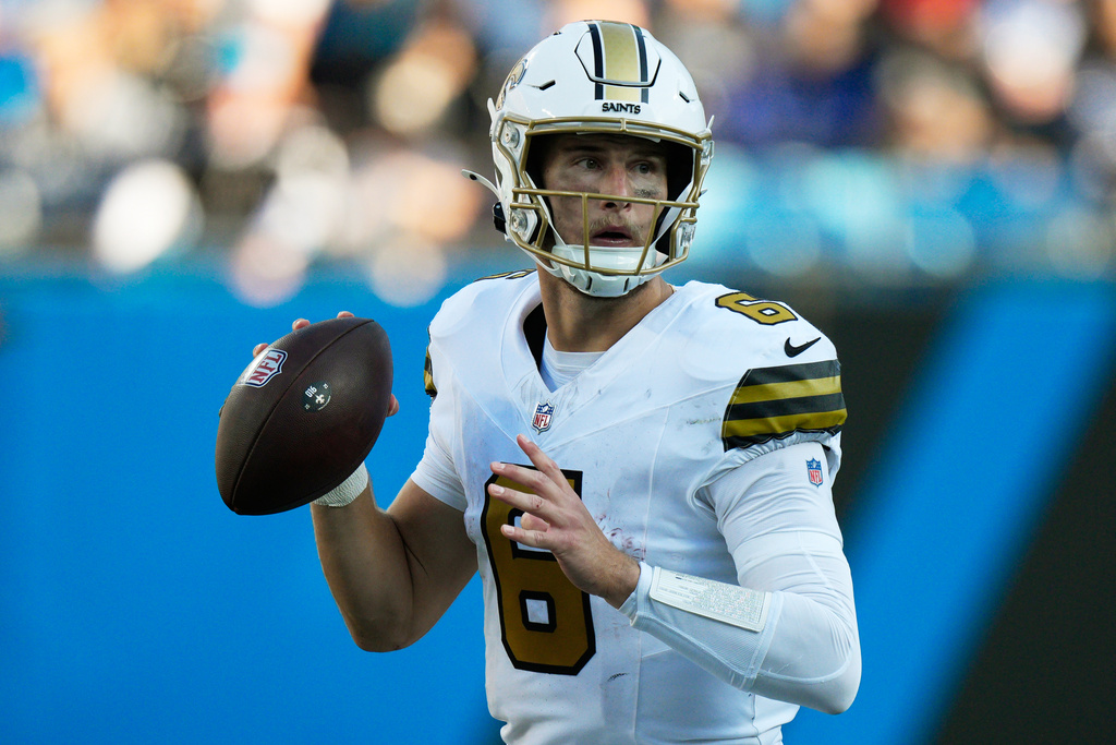 New Orleans Saints quarterback Tyler Shough passes against the Carolina Panthers during the second half of an NFL football game, Sunday, Nov. 9, 2025, in Charlotte, N.C. (AP Photo/Jacob Kupferman)