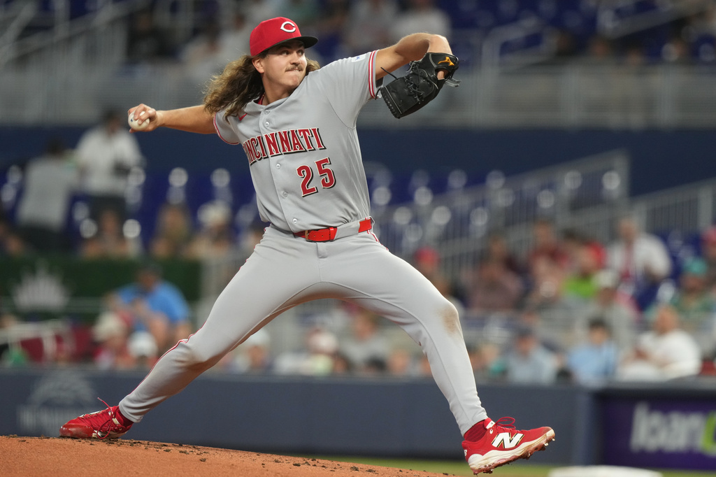 Cincinnati Reds starting pitcher Rhett Lowder (25) aims a pitch during the first inning of a baseball game against the Miami Marlins Thursday, April 9, 2026, in Miami. (AP Photo/Marta Lavandier)
