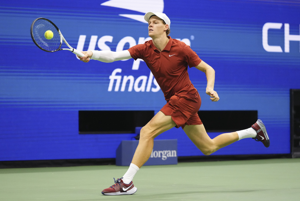 Jannik Sinner, of Italy, returns a shot to Carlos Alcaraz, of Spain, during the men's singles final of the U.S. Open tennis championships, Sunday, Sept. 7, 2025, in New York. (AP Photo/Kirsty Wigglesworth)