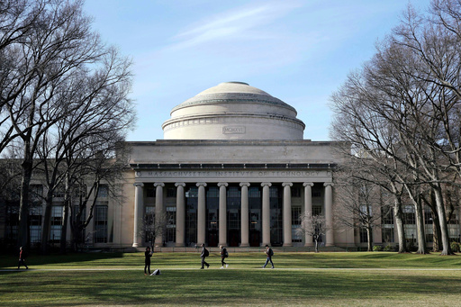 FILE - Students walk past the "Great Dome" atop Building 10 on the Massachusetts Institute of Technology campus in Cambridge, Mass, April 3, 2017. (AP Photo/Charles Krupa, File) FILE - Students walk past the "Great Dome" atop Building 10 on the Massachusetts Institute of Technology campus in Cambridge, Mass, April 3, 2017. (AP Photo/Charles Krupa, File)