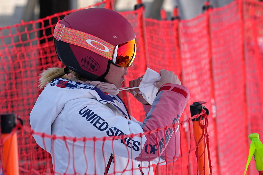 FILE - Mikaela Shiffrin of the United States adjusts her face mask before heading to the gondola to go up the alpine ski course for a training run at the 2022 Winter Olympics, Feb. 10, 2022, in the Yanqing district of Beijing. (AP Photo/Luca Bruno, file)