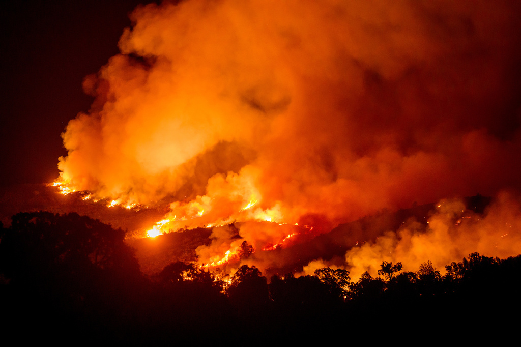 The Gann Fire burns along a hillside near Copperopolis on Tuesday, Aug. 4, 2026, in Calaveras County, Calif. (AP Photo/Noah Berger)