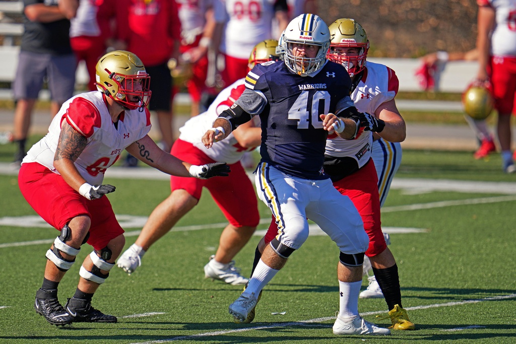 Seeing his first college football game action, Lycoming College nose tackle Tom Cillo (40) spins away from a block during the second half of an NCAA Division III college junior varsity football game against King's College in Williamsport, Pa., Sunday, Sept. 28, 2025. (AP Photo/Gene J. Puskar)