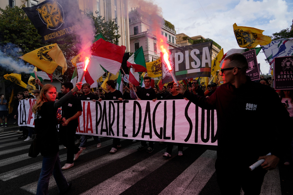 Members of right-wing student groups march through the streets of Rome, Saturday, Oct. 24, 2026, during a demonstration called "Unlock Everything," organized in opposition to recent left-wing student protests and one of several demonstrations held by groups across the political spectrum. (AP Photo/Gregorio Borgia)