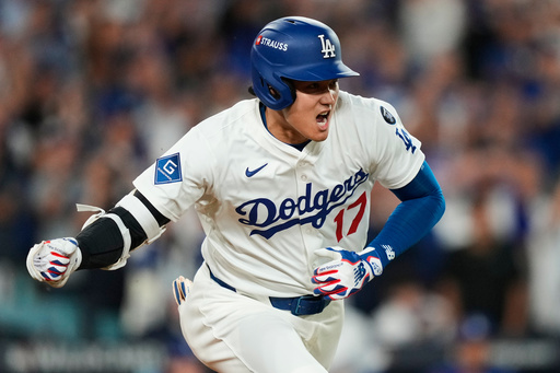 Los Angeles Dodgers' Shohei Ohtani reacts as he drives in a run with a single during the sixth inning in Game 2 of the National League Wild Card baseball playoff series against the Cincinnati Reds, Wednesday, Oct. 1, 2025, in Los Angeles. (AP Photo/Mark J. Terrill) Los Angeles Dodgers' Shohei Ohtani reacts as he drives in a run with a single during the sixth inning in Game 2 of the National League Wild Card baseball playoff series against the Cincinnati Reds, Wednesday, Oct. 1, 2025, in Los Angeles. (AP Photo/Mark J. Terrill)