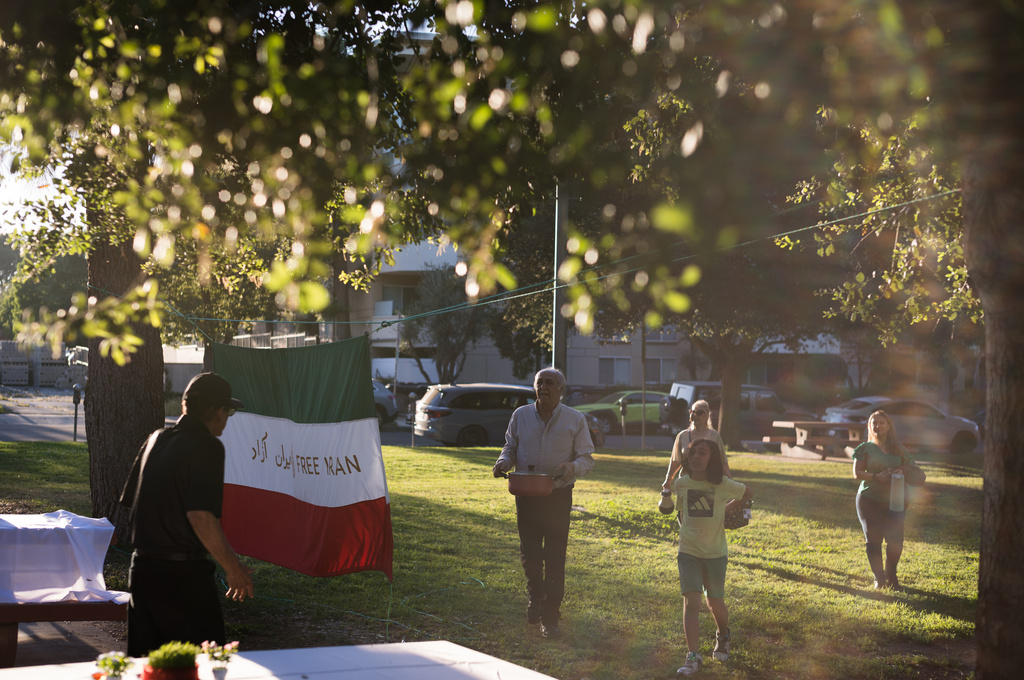People arrive at a park for a community gathering ahead of the Nowruz holiday in the Encino neighborhood of Los Angeles, March 17, 2026. (AP Photo/Jae C. Hong)