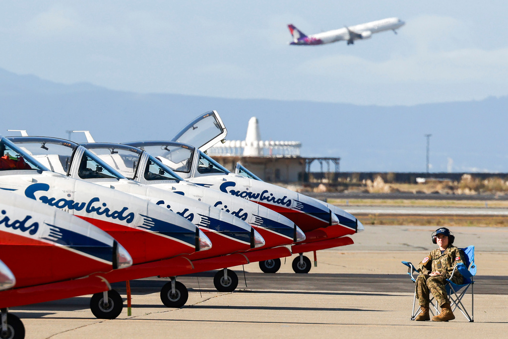 An engineer prepares the Royal Canadian Air Force’s Snowbirds Canadian-built CT-114 Tutor aircrafts for practice near Oakland International Airport in Oakland, Calif., Thursday, Oct. 9, 2025, ahead of the San Francisco Fleet Week Air Show where they will take the place of the Blue Angels amid the recent government shutdown. (Jessica Christian/San Francisco Chronicle via AP)