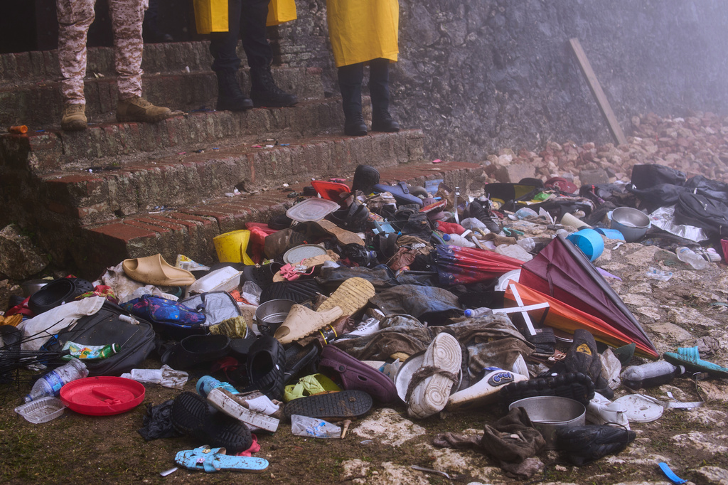 The shoes of victims of a deadly stampede sit by the main entrance of the Citadelle Laferriere in Milot, Haiti, Sunday, April 12, 2026. (AP Photo/Ketlain Difficile)