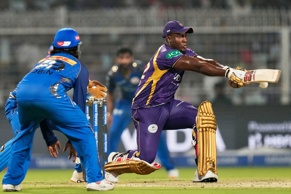 Kolkata Knight Riders' Rovman Powell plays a shot during the Indian Premier League cricket match between Kolkata Knight Riders and Mumbai Indians, in Kolkata , India, Wednesday, May 20, 2026. (AP Photo/Bikas Das)