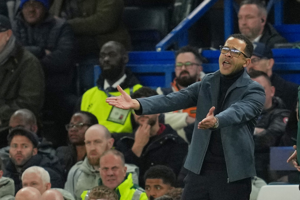 Chelsea's head coach Liam Rosenior reacts during the Champions League soccer match between Chelsea and Paris Saint-Germain in London, England, Tuesday, March 17, 2026. (AP Photo/Kin Cheung)