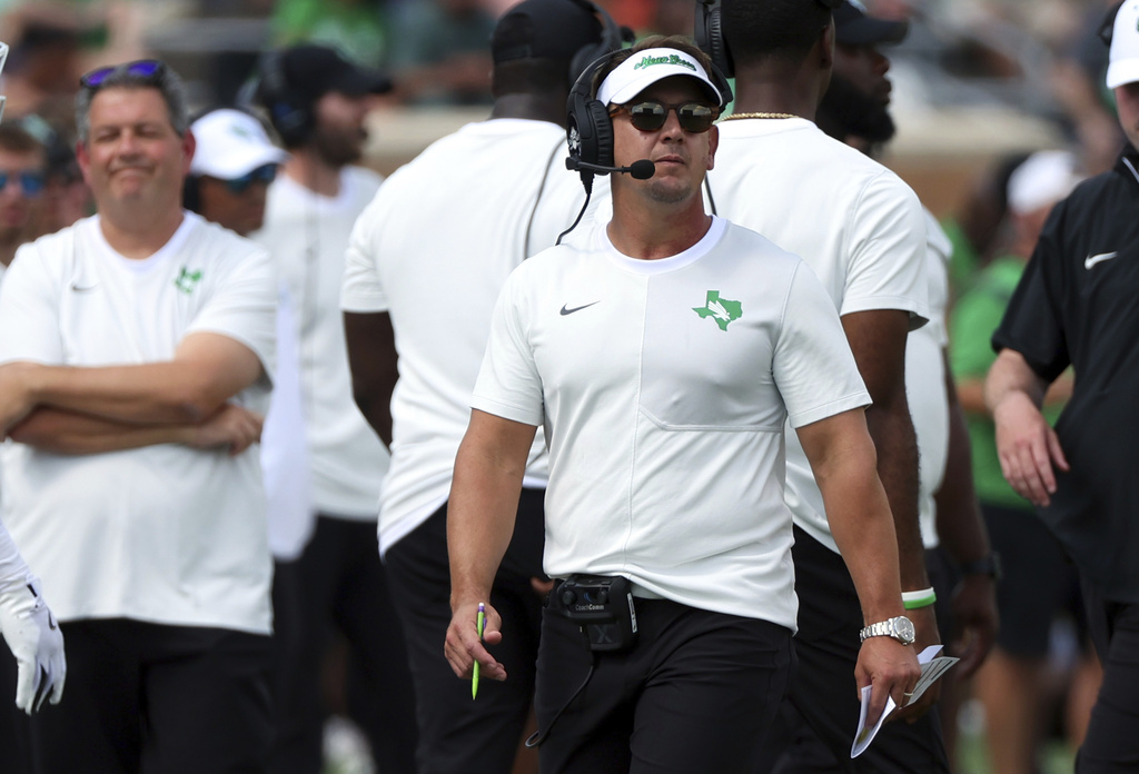 North Texas head coach Eric Morris walks the sideline during an NCAA college football game against Washington State, Saturday, Sept. 13, 2025, in Denton, Texas. (AP Photo/Richard W. Rodriguez)