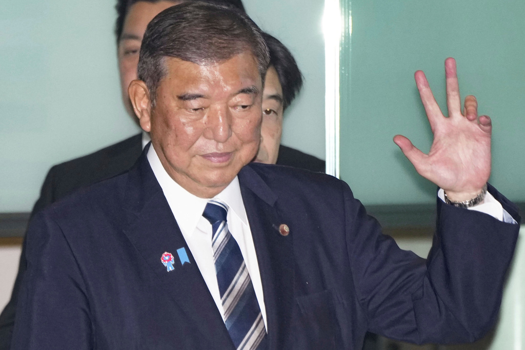 Japanese Prime Minister Shigeru Ishiba arrives at the prime minister's office in Tokyo, Japan, Sunday, Sept. 7, 2025. (Kyodo News via AP)