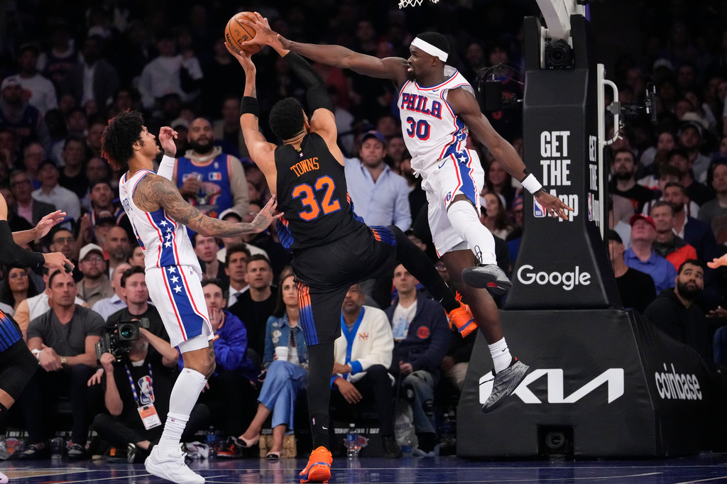 Philadelphia 76ers center Adem Bona (30) blocks New York Knicks center Karl-Anthony Towns (32) during the second half of Game 2 in a second-round NBA basketball playoffs series, Wednesday, May 6, 2026, in New York. (AP Photo/Yuki Iwamura)
