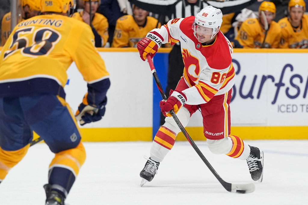 Calgary Flames left wing Joel Farabee (86) shoots the puck during the first period of an NHL hockey game against the Nashville Predators, Saturday, Nov. 1, 2025, in Nashville, Tenn. (AP Photo/Camden Hall)