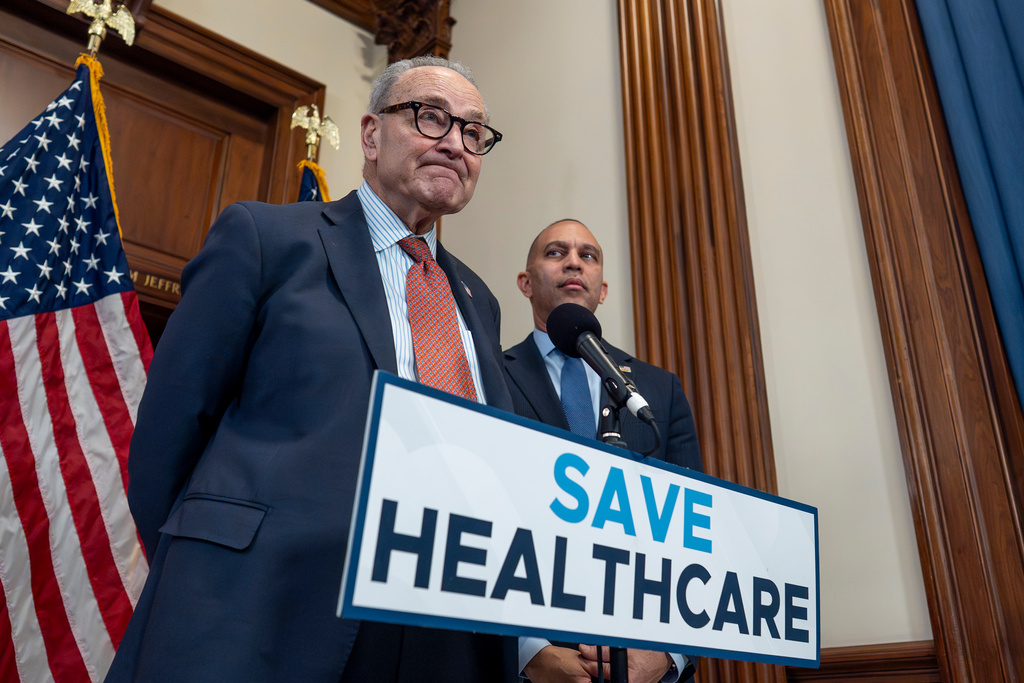 FILE - Senate Minority Leader Chuck Schumer, D-N.Y., left, and House Minority Leader Hakeem Jeffries, D-N.Y., meet with reporters to speak about health care affordability at the Capitol in Washington, Dec. 3, 2025. (AP Photo/J. Scott Applewhite, file)