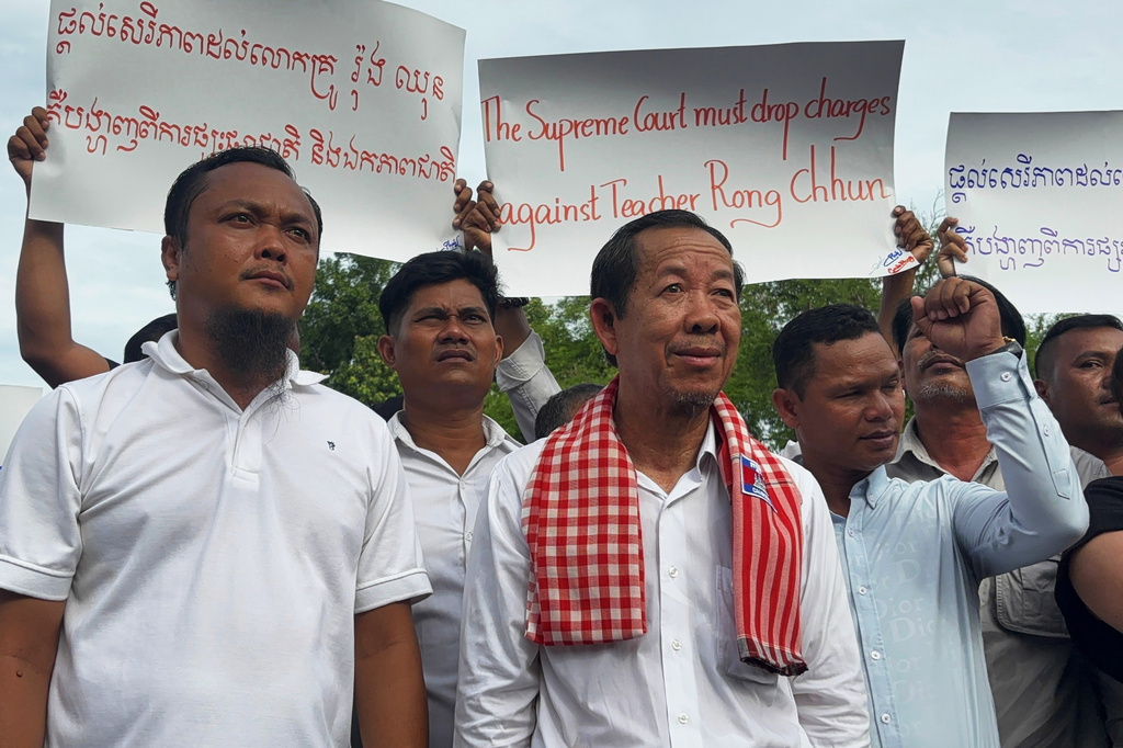 Rong Chhun, a top adviser to the Nation Power Party and a prominent opposition politician, stands with supporters outside Cambodia's Supreme Court in Phnom Penh, Friday, June 19, 2026. (AP Photo/Sopheng Cheang)