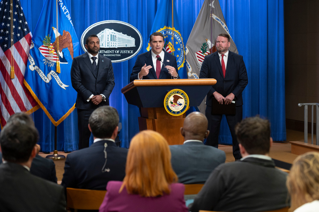 FBI Director Kash Patel, left, Acting Attorney General Todd Blanche, center, and Ellis Boyle, U.S. Attorney for the Eastern District of of N.C., announce that former FBI Director James Comey has been indicted, at the Justice Department in Washington, Tuesday, April 28, 2026. (AP Photo/Cliff Owen)