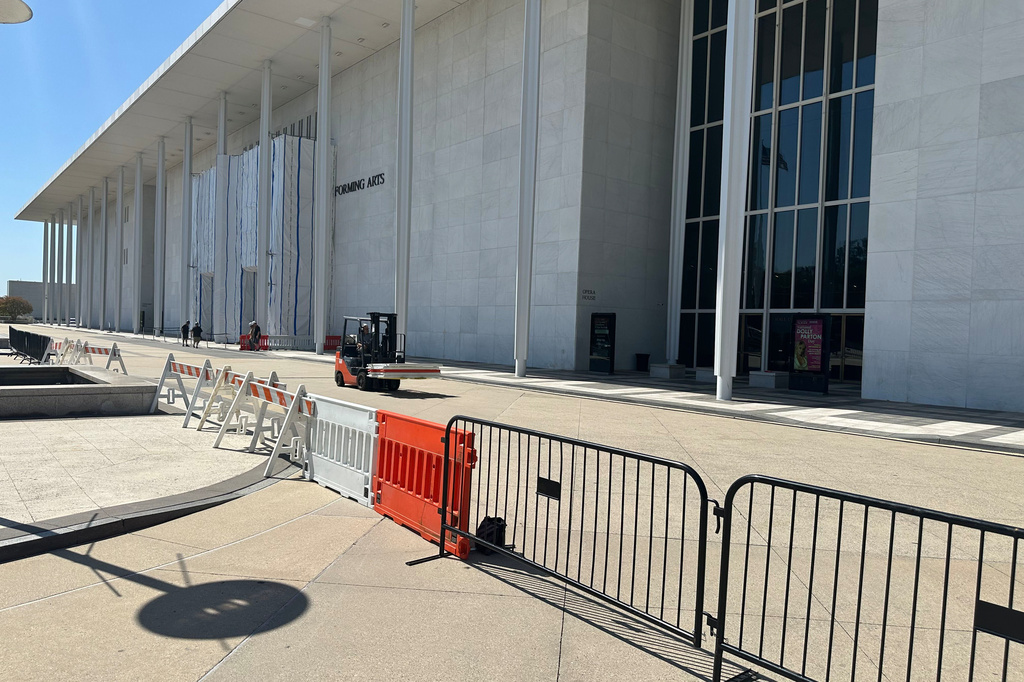 Barriers are placed outside the John F. Kennedy Center for the Performing Arts on Wednesday, Sept. 16, 2026, in Washington. (AP Photo/Nathan Ellgren)
