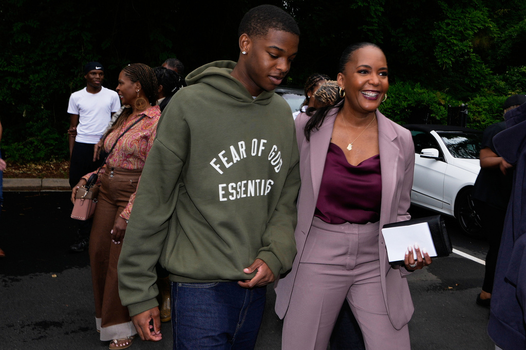Democratic candidate for governor, Keisha Lance Bottoms, walks to vote early with her son, Langston Bottoms, in the Georgia Primary Election, Thursday, May 7, 2026, in Atlanta. (AP Photo/Brynn Anderson)