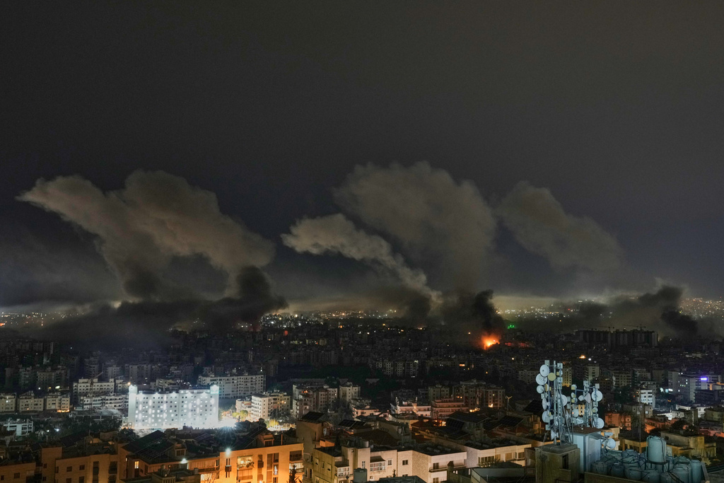 Smoke rises from buildings following an Israeli airstrike in Dahiyeh, Beirut's southern suburbs, Lebanon, Wednesday, March 11, 2026. (AP Photo/Bilal Hussein)