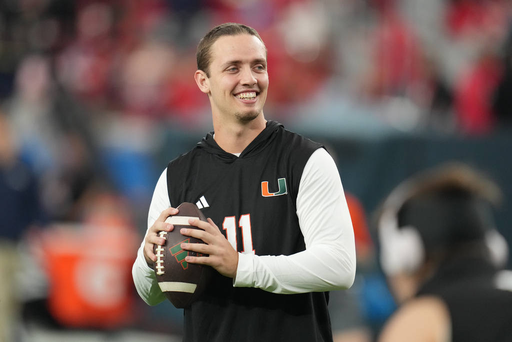 Miami quarterback Carson Beck warms up before the Fiesta Bowl NCAA college football playoff semifinal game against Mississippi, Thursday, Jan. 8, 2026, in Glendale, Ariz. (AP Photo/Rick Scuteri)