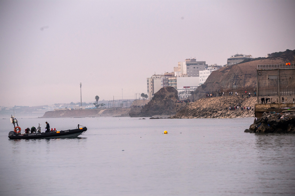 Migrants return to Morocco from the Spanish enclave of Ceuta, Saturday, Aug. 1, 2026. (AP Photo/Antonio Sempere)