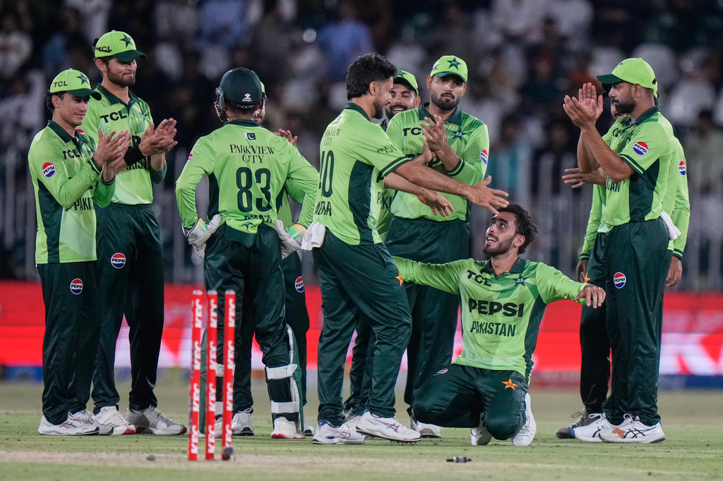 Pakistan's Arafat Minhas, bottom second right, celebrates with teammates after taking wicket of Australia's Nathan Ellis during the first One Day International cricket match between Pakistan and Australia, in Rawalpindi, Pakistan, Saturday, May 30, 2026. (AP Photo/Anjum Naveed)