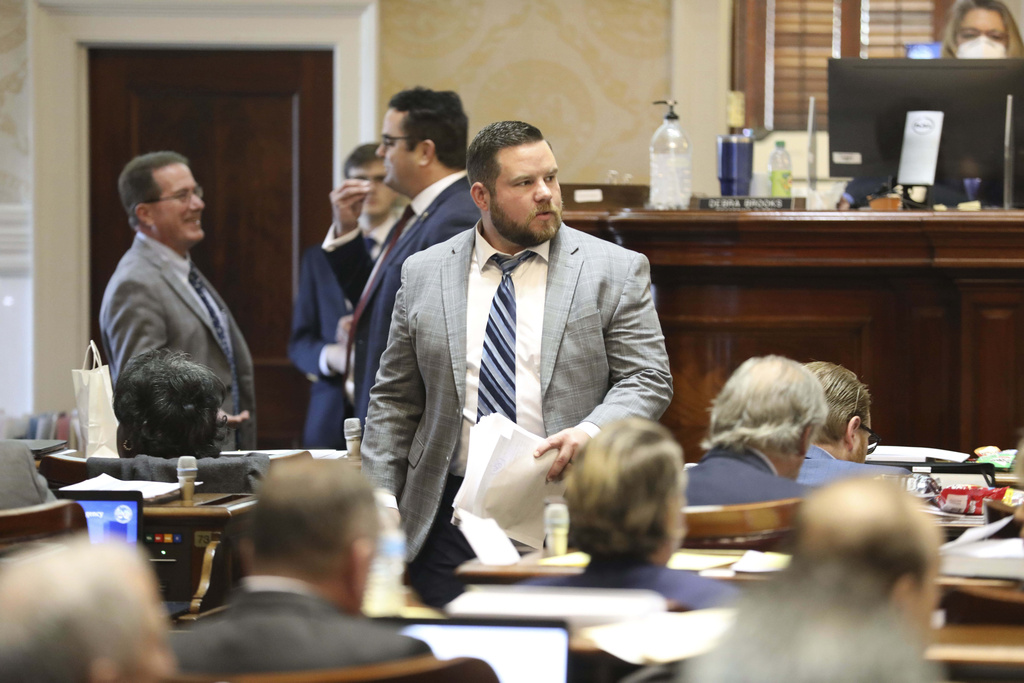 FILE - South Carolina Rep. RJ May, R-West Columbia, walks down the aisle of the House, Tuesday, March 14, 2023, in Columbia, S.C. (AP Photo/Jeffrey Collins, File)