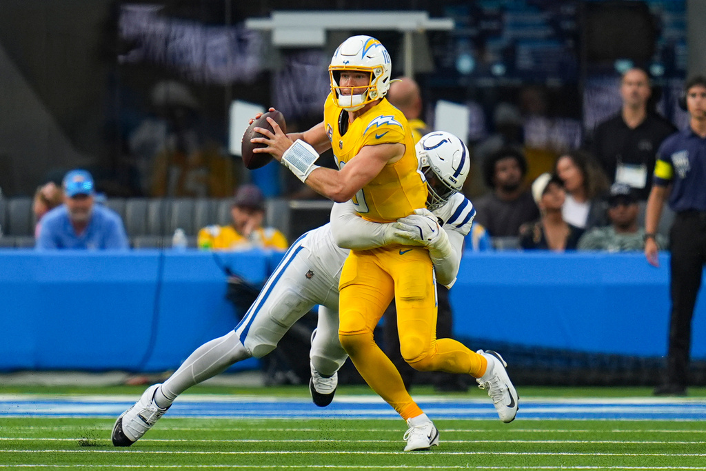 Indianapolis Colts defensive tackle Deforest Buckner (99) sacks Los Angeles Chargers quarterback Justin Herbert (10) during the second half of an NFL football game Sunday, Oct. 19, 2025, in Inglewood, Calif. (AP Photo/Gregory Bull)