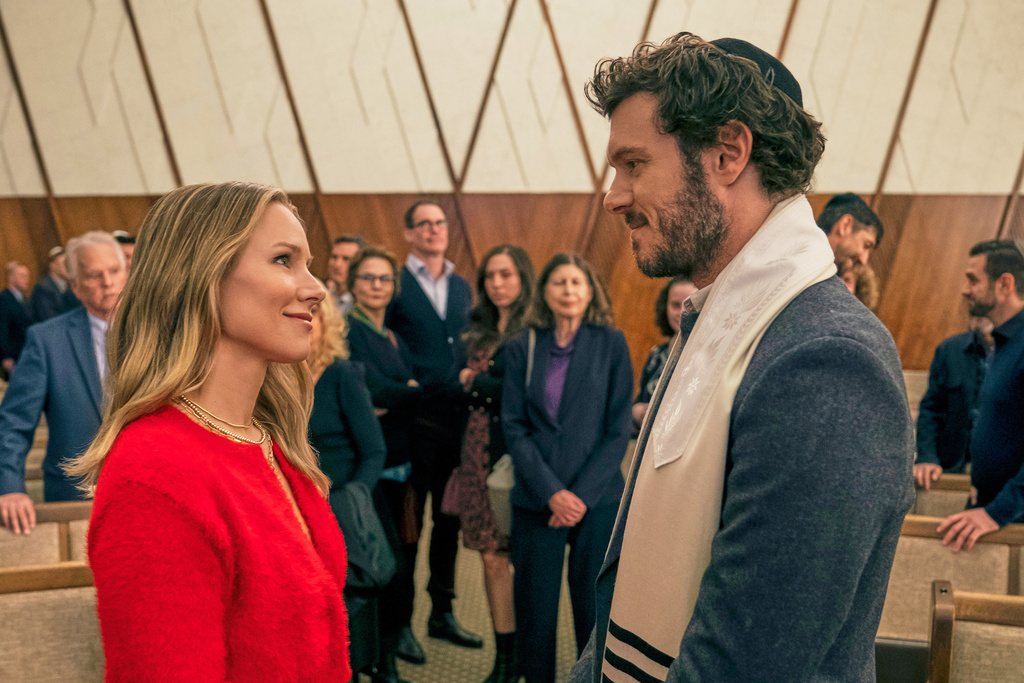 This image released by Netflix shows Kristen Bell, left, and Adam Brody in a scene from "Nobody Wants This." (Stefania Rosini/Netflix via AP)