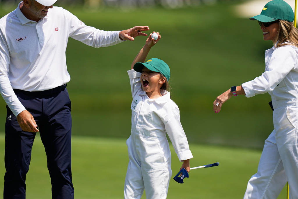 Sergio Garcia's daughter, Azalea, center, celebrates her shot on the eighth hole during par-3 contest ahead of the Masters golf tournament at the Augusta National Golf Club, Wednesday, April 8, 2026, in Augusta, Ga. (AP Photo/Eric Gay)